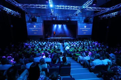 House Shout — hall event lit in house colours