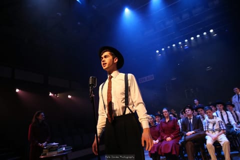 Concert lighting — wide stage view with aerial beams