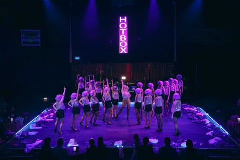 Guys & Dolls — musical number under bold stage lighting