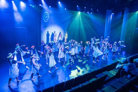 Moana — ensemble scene in ocean blues and warm accents